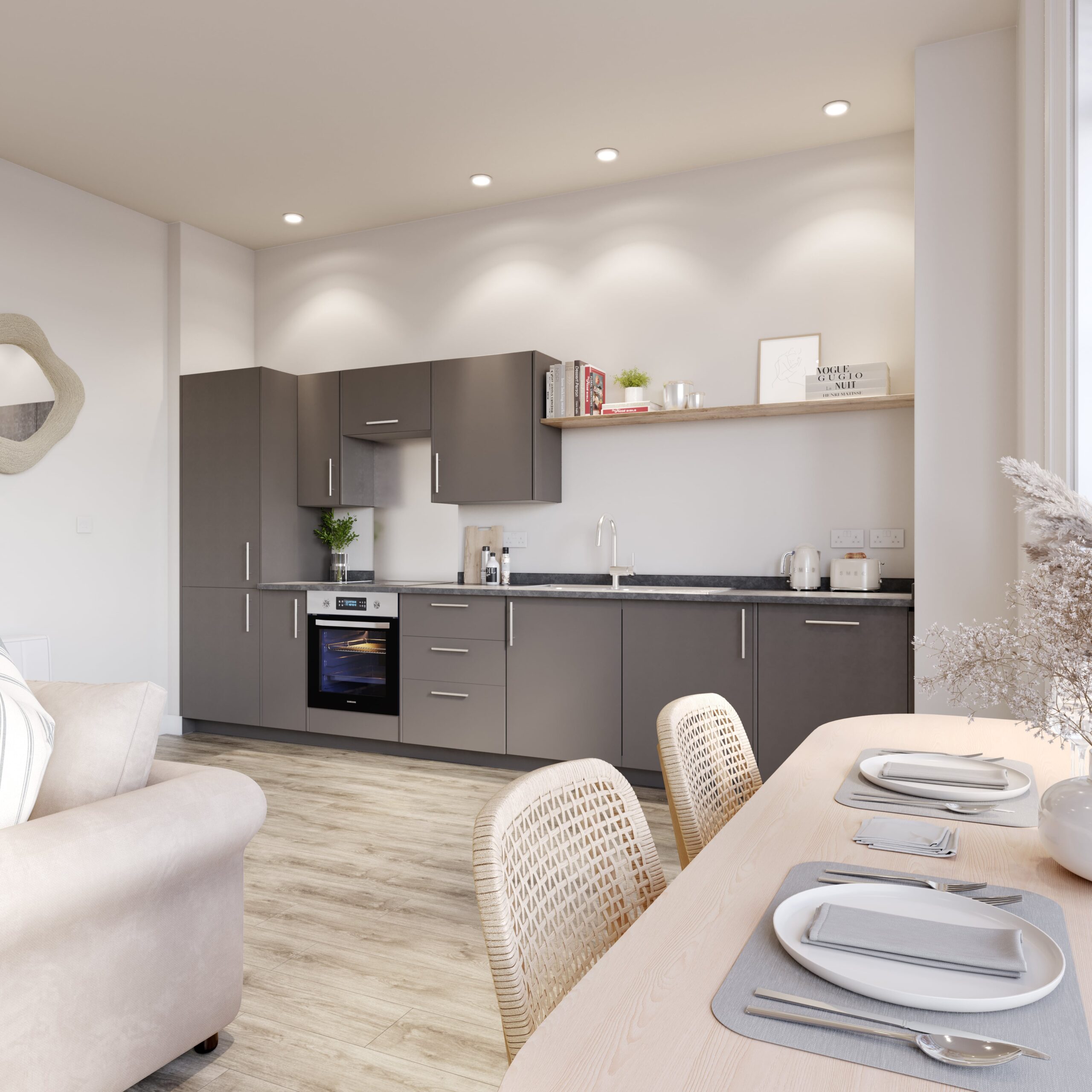 Interior CGI of a contemporary kitchen at The Esperance in Eastbourne, featuring matt grey cabinetry, dark worktops, integrated appliances and a light wood dining table with woven chairs.