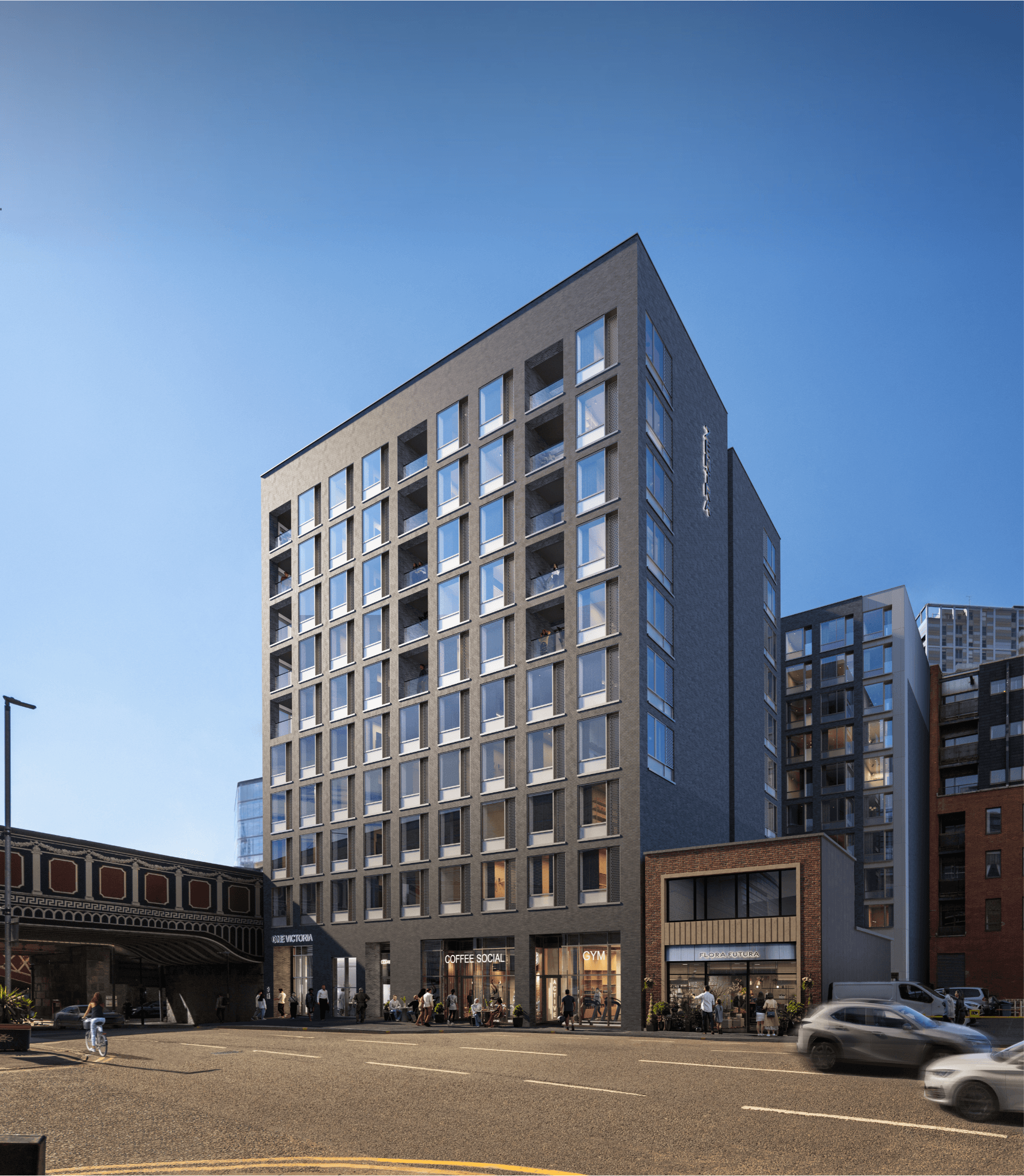 Architectural CGI of One Victoria in Manchester showing the residential development with street-level amenities and contemporary building design.