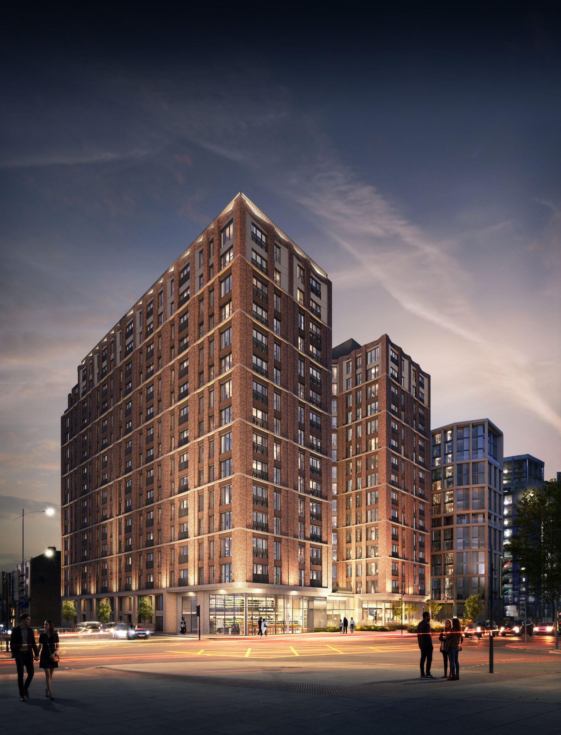 Exterior CGI of The Forge in Liverpool at dusk, with illuminated red-brick façades, ground-floor commercial space and surrounding streets.